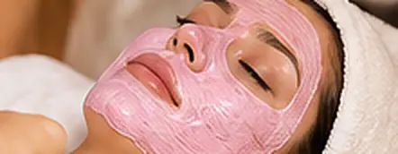 Client wearing a pink firming mask